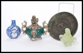 A group lot of Chinese wares to include a jade type censer ding bowl, another larger white metal and