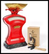 A vintage 20th century set of Pooley cast iron grocers' scales with non associated brass tray in red