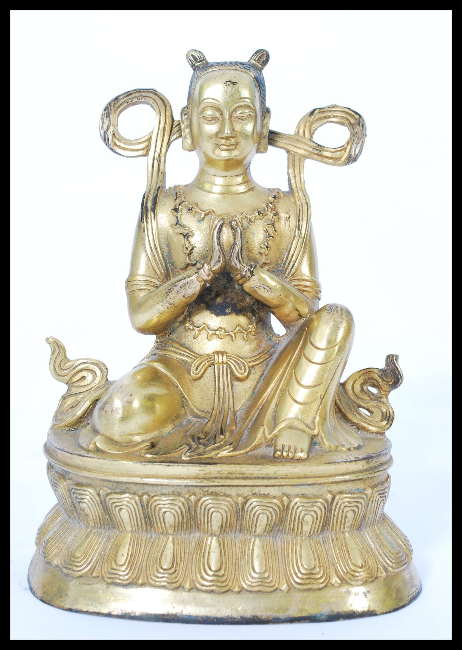 A 19th century gilt bronze statue of a Buddha raised on pedestal base with scrolled robe and - Image 3 of 4