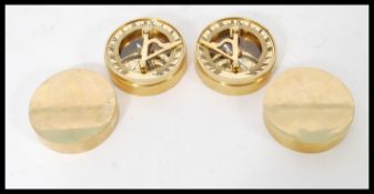 A pair of vintage style brass cased nautical compass sundial compendiums having folding sundial arms