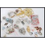 A group of vintage costume jewellery to include bone bead necklaces, brooches, necklaces, West