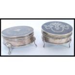 Two silver hallmarked and tortoiseshell boxes of circular form each having inlaid decoration and