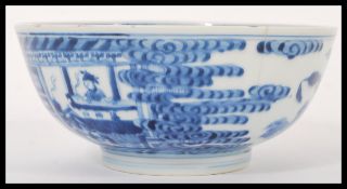 A 19th century Chinese blue and white bowl hand painted with scene of Geisha's fences and  trees