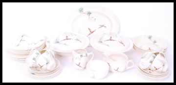 A Royal Doulton ceramic dinner service in the Coppice pattern consisting of plates, tureens etc.