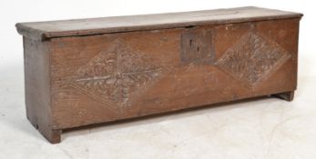 A 17th century West Country oak coffer - sword box. Of simple form with carved detailing and