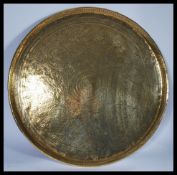 A 19th century Indian brass charger of roundel for