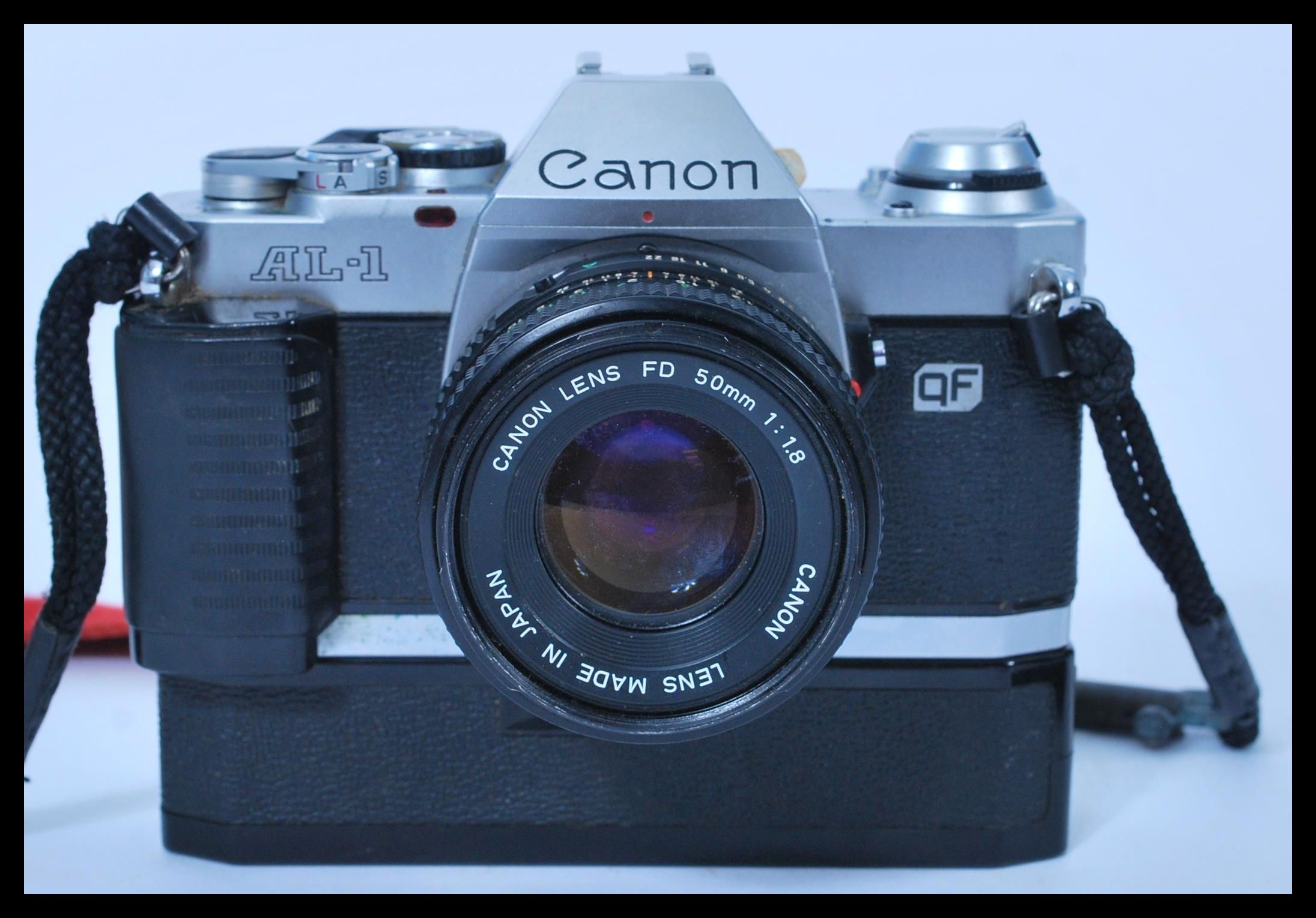 A vintage 1983 Canon AL-1 SLR Camera complete with authentic Canon neck ...