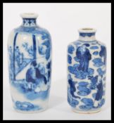 Two 19th century Chinese blue and white snuff bottles/ vases having hand painted decoration of