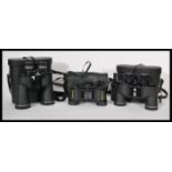 A collection of three cased 20th Century cased binoculars, different makers. In case measures 22