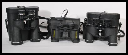 A collection of three cased 20th Century cased binoculars, different makers. In case measures 22