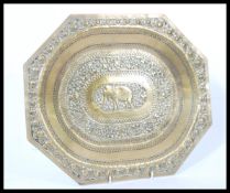An early 20th century circa 1900 Indian brass tray depicting an elephant to the central panel. The