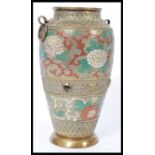 A 19th century Chinese bronze and enamel baluster vase raised on a circular base with hoop
