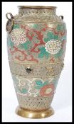 A 19th century Chinese bronze and enamel baluster vase raised on a circular base with hoop