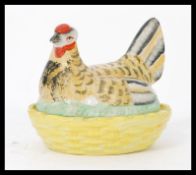 A 19th century Staffordshire model of a hen raised on basket base. Please see images Measures