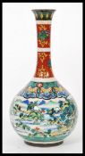 A 19th century Chinese baluster bottle vase. The globular body having Famille Verte decoration