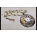 An early 20th century silver hallmarked London import pocket watch in a half hunter silver case. The