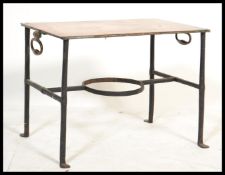 A 19th century cast iron and copper coaching stool / stand. The copper panel top over wrought and