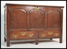 An 18th century George III country oak mule chest coffer. Raised on stile legs with a series of