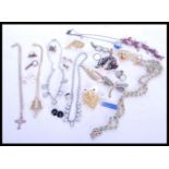 A group of vintage costume jewellery to include brooches, cufflinks, necklaces etc. Brooches to