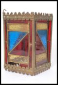 An early 20th century Arts & Crafts stained leaded glass porch lantern of square form having