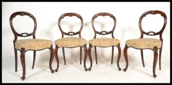 A set of 4 Victorian 19th century rosewood balloon back dining chairs. Raised on serpentine reeded