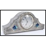 A Tudric pewter Art Nouveau mantle clock in the manner of Archibald Knox of Liberties. The clock
