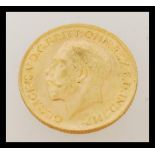 An early 20th century George V full sovereign gold coin dated 1913. Weighs 7.98 grams.