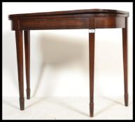 An 18th / 19th century George III mahogany and line ebony inlaid tea table / games card table.