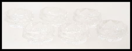 A set of six 19th century Georgian facet cut glass small table salts. Each of lozenge shaped form