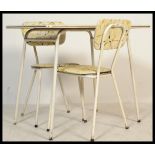 A vintage retro mid 20th century 1950's Formica table and chairs raised on white tubular metal