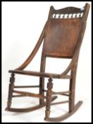 A 19th century Victorian nursing rocking chair having inlay shell decoration raised on shaped