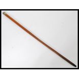 A period silver hallmarked walking stick cane having a tapering Malacca wood shaft with silver