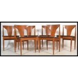 Elliots of Newbury - A set of four vintage 20th century teak dining chairs having black vinyl