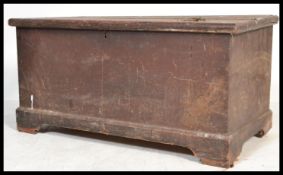 A large Victorian pine blanket box having a plinth base with panel sides and hinged top ( hinges