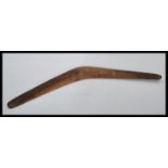 A 19th century Australian Aboriginal boomerang of simple form hand carved from a single piece of