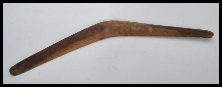 A 19th century Australian Aboriginal boomerang of simple form hand carved from a single piece of
