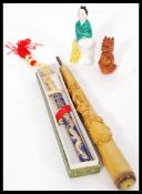 A collection of items including a Chinese paper knife in its original box with dragon detailing.