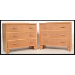 A pair of vintage retro 20th Century matching chest of drawers, in light oak having a run of three