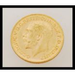 An early 20th century George V full sovereign gold coin dated 1911. Weighs 7.98 grams.