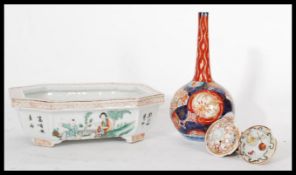 A group of Chinese and Japanese ceramics dating from the 19th century to include an Imari baluster