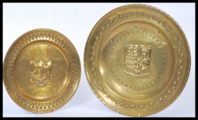 Two 19th century Victorian brass chargers depicting the Bristol coat of arms. Measures 41cms wide