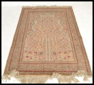 A 20th century Turkish Islamic carpet rug having a cream ground with tree of life decoration.