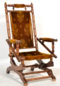 A Victorian 19th century walnut American Boston rocker - rocking chair set on spring frame with