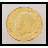 An early 20th century George V full sovereign gold coin dated 1929. Weighs 7.98 grams.