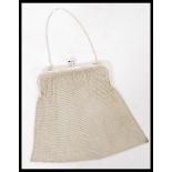 A Sterling 935 silver ladies mesh purse with chase decorated mounted top inset blue glass stone