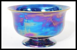 A Carlton ware pedestal lustre bowl raised on tapered foot with makers marks to base. Measures 12.