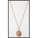 A hallmarked 9ct gold intaglio fob seal locket pendant necklace on 9ct gold chain. Weighs 9.6