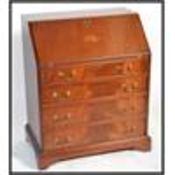 An Edwardian style mahogany inlaid bureau desk bei