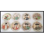 A set of eight vintage 20th Century Royal Doulton character plates to include The Falconer, The