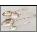 A group of four Georgian and Victorian silver hallmarked spoons to include a Georgian table